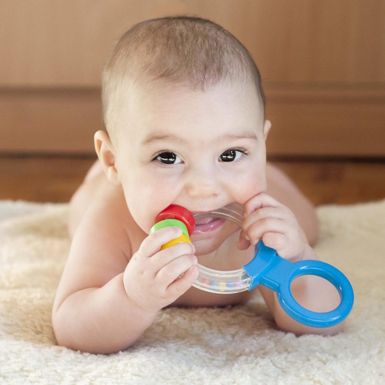 Babies will mouth toys as they explore their environment, this is a form of play.